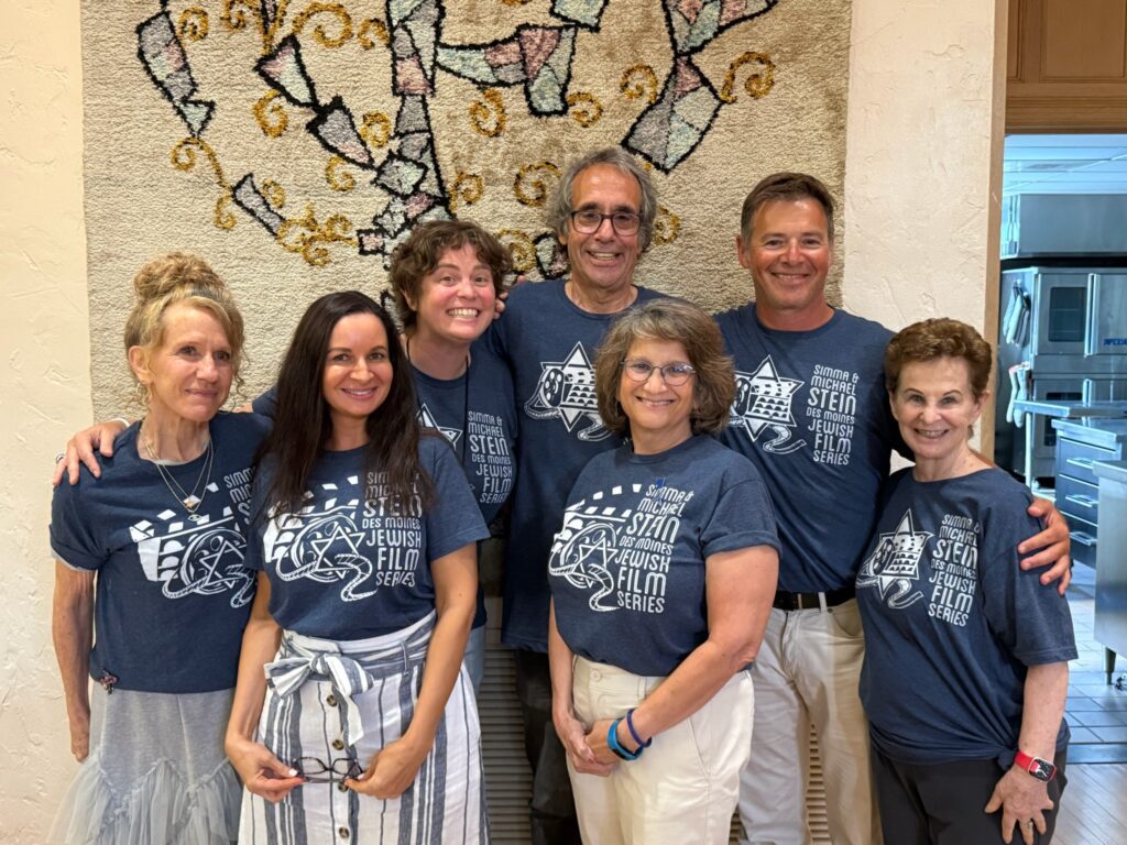 Members of the Film Society in front of art.